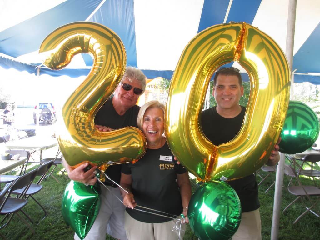 George Staniulis, Ruta Staniulis, and Chris Racelis celebrate 20 years.